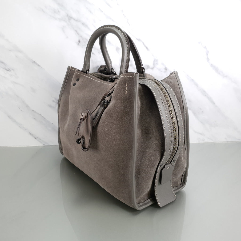 Suede best sale coach handbags