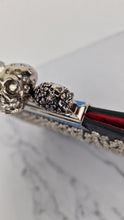 Load image into Gallery viewer, Alexander McQueen Knuckle Skull Flat Clutch in Black Leather Studded 4 Ring Clutch