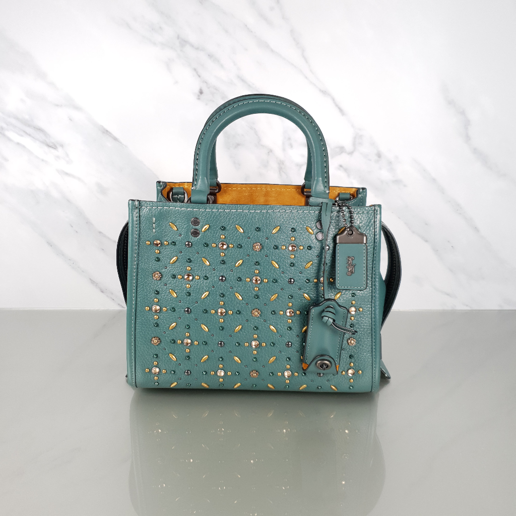 Coach rogue with rivets sales