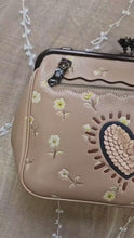 Load and play video in Gallery viewer, 1941 Coach x Keith Haring Kisslock Crossbody Bag With Vintage Prairie Print, Sequin Heart & C-chain Strap in Nude Pink - Coach 29113