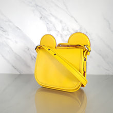 Load image into Gallery viewer,  Disney x Coach Patricia Saddle Bag Yellow Mickey Ears outlet shoulder bag
