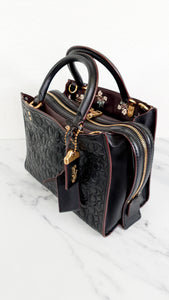 Coach Rogue 25 in Black Signature Embossed Leather with Burgundy Floral Bow Leather Lining - Coach 26839