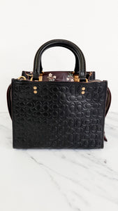 Coach Rogue 25 in Black Signature Embossed Leather with Burgundy Floral Bow Leather Lining - Coach 26839