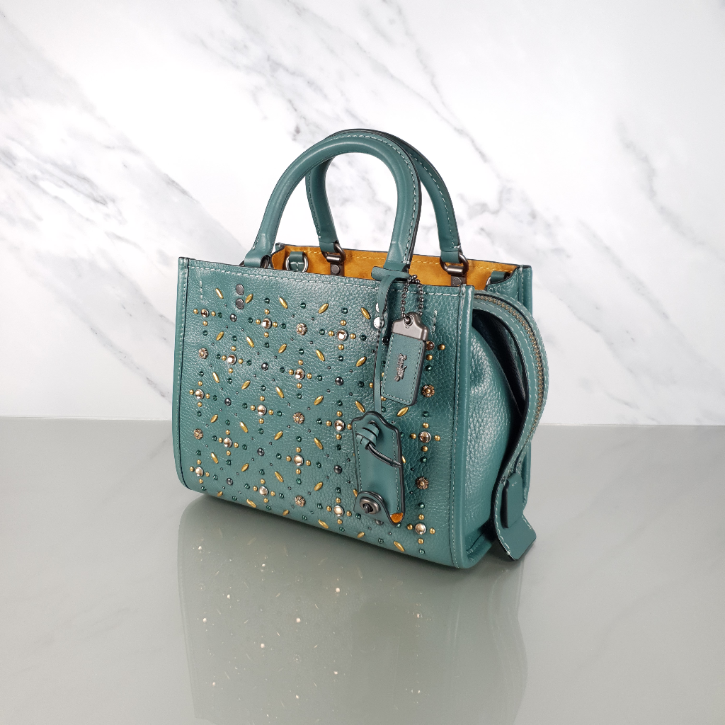 Coach top rogue rivets