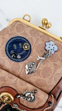 Load image into Gallery viewer, Limited Edition Coach x Keith Haring 1941 Frame Kisslock Clutch Pouch with Patchwork &amp; Embellishments in Signature &amp; Saddle Brown - Charms, Rexy, Crystals, Rivets, Tea Roses - Coach 31068
