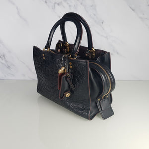 Coach Rogue 25 in Black Signature Embossed Leather with Floral Bow Lining 26839