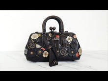 Load and play video in Gallery viewer, RARE Coach 1941 Kisslock Satchel Frame Bag with Tea Roses - Black &amp; Purple - Limited Edition Crossbody Handbag - Coach 21589
